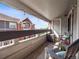 Relaxing balcony with seating, potted plant, and a view of surrounding buildings at 14439 E 1St Dr # C11, Aurora, CO 80011