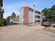 Apartment complex with well-maintained landscaping, private balconies, and ample parking spaces at 14439 E 1St Dr # C11, Aurora, CO 80011