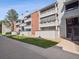 A modern condo exterior with well-maintained landscaping and multiple levels of private balconies at 14439 E 1St Dr # C11, Aurora, CO 80011