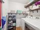 Convenient laundry room with washer, dryer, and ample shelving for storage and organization at 14439 E 1St Dr # C11, Aurora, CO 80011