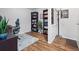 Well-organized office space features wood floors, bookshelves, and a comfortable work area at 14439 E 1St Dr # C11, Aurora, CO 80011