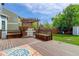 Back deck features built-in seating, a pergola, and a stainless steel grill at 9954 Heywood St, Highlands Ranch, CO 80130