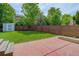 Private fenced backyard featuring a lawn, shed, and concrete patio perfect for relaxing or entertaining at 9954 Heywood St, Highlands Ranch, CO 80130