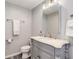 Classic bathroom featuring a pedestal sink, toilet, and tiled floor at 9954 Heywood St, Highlands Ranch, CO 80130
