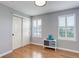 Serene bedroom featuring wood floors, natural light, and a double door closet at 9954 Heywood St, Highlands Ranch, CO 80130