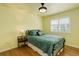 Inviting bedroom with warm lighting, hardwood floors and a comfortable bed at 9954 Heywood St, Highlands Ranch, CO 80130