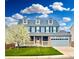 Charming two-story home with a landscaped front yard and a two-car attached garage at 9954 Heywood St, Highlands Ranch, CO 80130
