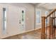 The front foyer includes tile flooring and a beautiful white front door with sidelights at 9954 Heywood St, Highlands Ranch, CO 80130