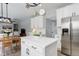 Open concept kitchen with an island, stainless steel appliances, and plenty of counter space at 9954 Heywood St, Highlands Ranch, CO 80130