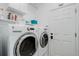 Well-lit laundry room features a white washer and dryer at 9954 Heywood St, Highlands Ranch, CO 80130