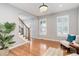 Bright living room with hardwood floors, plantation shutters, and stylish decor at 9954 Heywood St, Highlands Ranch, CO 80130