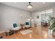 Cozy living room featuring hardwood floors, gray walls, and comfortable seating at 9954 Heywood St, Highlands Ranch, CO 80130
