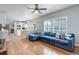 Open-concept living room flowing into a modern kitchen, perfect for entertaining at 9954 Heywood St, Highlands Ranch, CO 80130