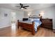 Spacious main bedroom featuring hardwood floors and en suite bathroom at 9954 Heywood St, Highlands Ranch, CO 80130