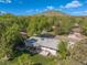 Scenic aerial view of the property, showcasing the backyard, deck, and surrounding landscape with mountain backdrop at 13402 W 24Th Pl, Golden, CO 80401