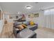 Spacious basement area includes a large sectional sofa and entertainment space with games at 13402 W 24Th Pl, Golden, CO 80401