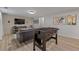 Finished basement featuring a foosball table, media center, and comfortable seating area at 13402 W 24Th Pl, Golden, CO 80401