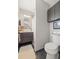 Bathroom featuring stylish vanity with modern fixtures and decorative mosaic backsplash at 13402 W 24Th Pl, Golden, CO 80401
