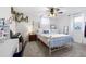 Bright bedroom with a ceiling fan, and unique decor at 13402 W 24Th Pl, Golden, CO 80401