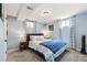 Comfortable bedroom with soft blue walls, and natural light at 13402 W 24Th Pl, Golden, CO 80401
