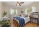 Bright bedroom with natural light, hardwood floors, and charming decor at 13402 W 24Th Pl, Golden, CO 80401