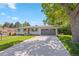Charming one-story home with a well-manicured lawn, attached garage, and inviting curb appeal at 13402 W 24Th Pl, Golden, CO 80401