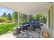 Inviting covered patio with a comfortable seating area, perfect for outdoor relaxation and entertaining at 13402 W 24Th Pl, Golden, CO 80401