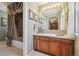 The bathroom boasts a vintage-style shower and vanity, complete with framed pictures and matching towel decor at 17298 E Lake Pl, Aurora, CO 80016