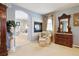 Luxurious bathroom with soaking tub, fireplace, walk-in shower, and vanity at 17298 E Lake Pl, Aurora, CO 80016