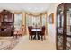 Bright dining area with bay windows, vintage decor and ample natural light at 17298 E Lake Pl, Aurora, CO 80016