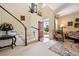 Elegant home entryway with staircase, high ceilings, and light-filled ambiance at 17298 E Lake Pl, Aurora, CO 80016