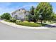 Corner lot home featuring mature trees and manicured landscaping at 17298 E Lake Pl, Aurora, CO 80016