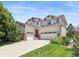 Beautiful two-story home with a three-car garage and well-maintained lawn at 17298 E Lake Pl, Aurora, CO 80016
