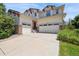 Inviting home exterior with a spacious driveway and a well-manicured lawn at 17298 E Lake Pl, Aurora, CO 80016