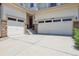 Spacious garage and driveway leading to a charming home entrance at 17298 E Lake Pl, Aurora, CO 80016
