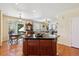 Open-concept kitchen with an island, dining area, and access to a spacious living area for easy entertaining at 17298 E Lake Pl, Aurora, CO 80016