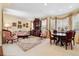 Living room and dining area with large windows and classic decor at 17298 E Lake Pl, Aurora, CO 80016