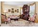 Charming living room featuring a vintage hutch and elegant decor at 17298 E Lake Pl, Aurora, CO 80016