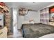 Bedroom featuring a full bed, natural light, and an open closet space at 8430 Madison Way, Denver, CO 80229