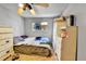 Bedroom features light colored walls, a ceiling fan, laminate floors and white furniture at 8430 Madison Way, Denver, CO 80229