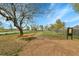 Well maintained community park featuring picnic benches, mature trees and a smooth groundcover surface at 8430 Madison Way, Denver, CO 80229