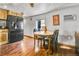 Cozy dining area adjacent to kitchen with a table and chairs plus a black refrigerator at 8430 Madison Way, Denver, CO 80229