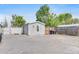 Charming gray home with white trim, fenced yard, and concrete driveway in a well-maintained community at 8430 Madison Way, Denver, CO 80229