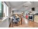 Living space featuring dining and a cozy living room with a large sectional couch at 8430 Madison Way, Denver, CO 80229
