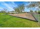 Fenced community playground with lush grass, playground equipment and a soft landing surface at 8430 Madison Way, Denver, CO 80229