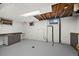 Unfinished basement area with laundry hookups and drop ceiling at 1994 Macon St, Aurora, CO 80010