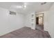 Finished basement room with built in shelves and access to other areas at 1994 Macon St, Aurora, CO 80010
