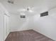 Basement room with carpet, closet, and multiple windows for light at 1994 Macon St, Aurora, CO 80010