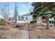Lovely single-story home with a quaint front yard, mature trees, and inviting curb appeal at 1994 Macon St, Aurora, CO 80010