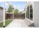 Backyard with a concrete patio, turf, string lights, and wooden fence at 4730 S Acoma St, Englewood, CO 80110